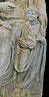 child with toga and bulla